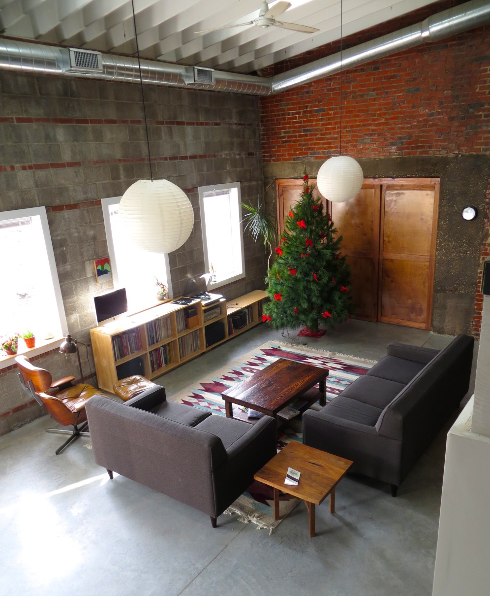 Our living room... Jess Bremer used this area to store and work on his amazing car collection. My wife's Grandpa, when he came into our apartment said that he used to be the mechanic!