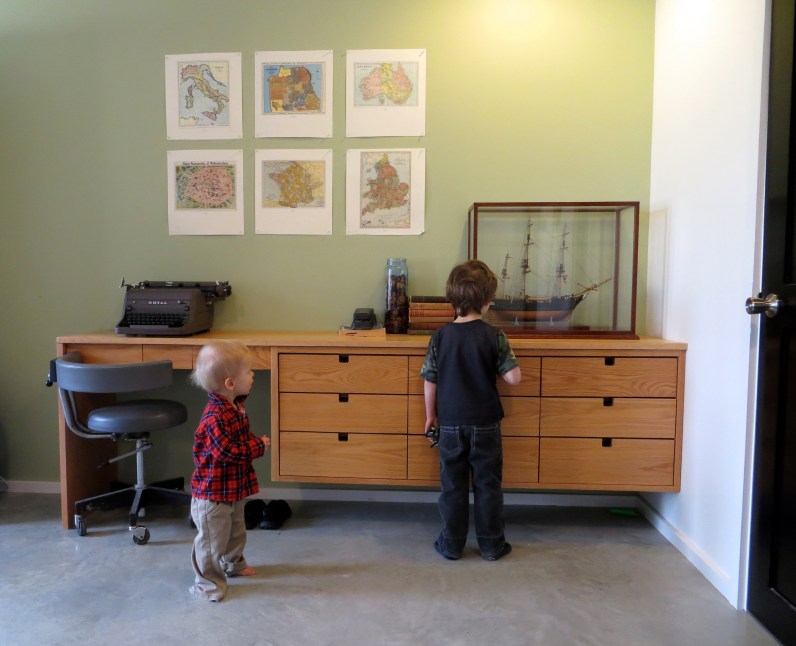 A custom built in by Brian Lee Carpentry. The ship model is a gift from my grandfather, Houghton Smith. The chair is from our dentists office! I commented on how I liked the chair and he gave me three of them! Hows that for perks of a small town!