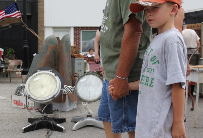 This kids giving me the stink eye, but man, I got to get a picture of those spot lights!